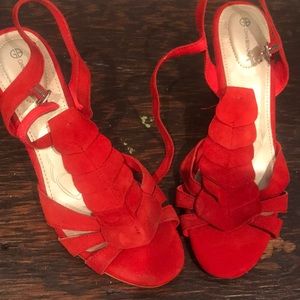 Red suede wedge heels.